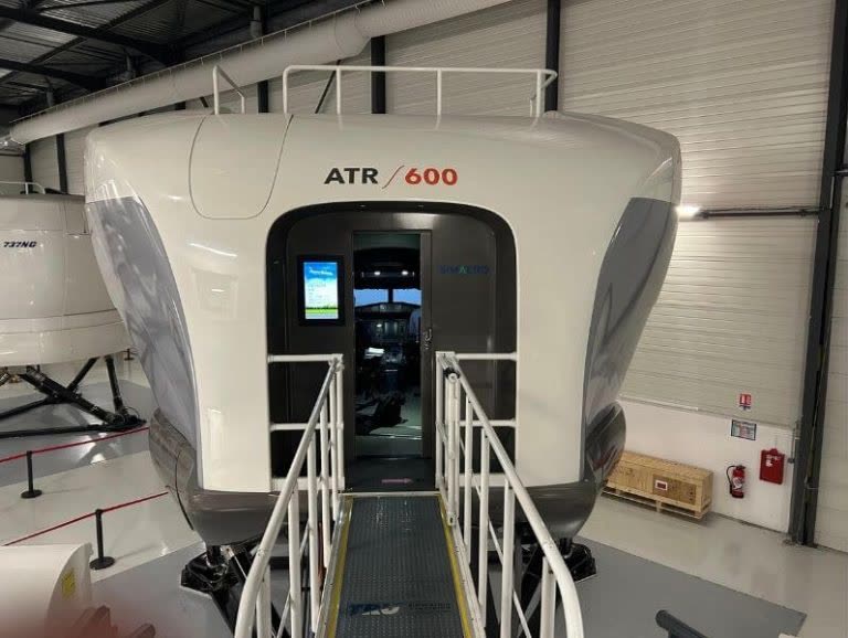 ATR 600 full flight simulator close-up exterior view showing fuselage and entry door